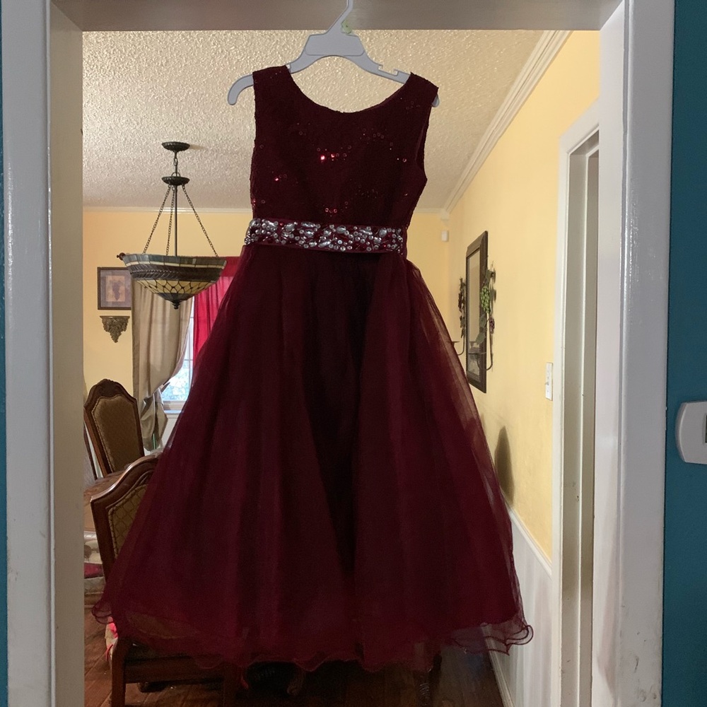 It is a red velvet with lace and gems